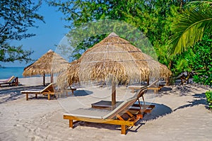 Sunbed and umbrella on Tropical beach on the island of Sihanoukville