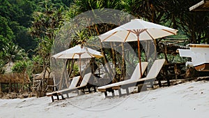 Sunbed on White Sand under Palms - Atuh Beach, Nusa Penida, Bali, Indonesia