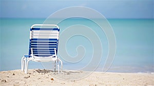 Sunbed on white tropical caribbean beach