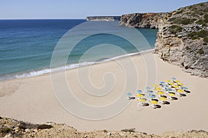 Sunbeds on a bautiful beach in Algarve, Portugal photo