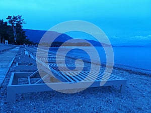 Sunbeds on the beach at the bluehour, background