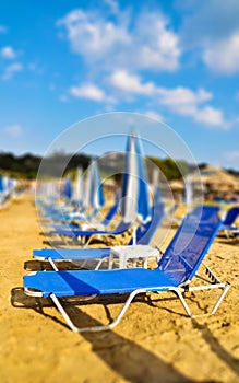 Sunbeds on the beach. Tilt shift photo