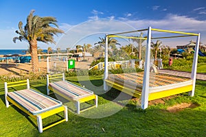 Sunbeds on the beach of tropical resort in Hurghada