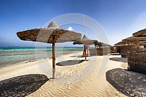 Sunbeds and beach umbrella in Marsa Alam, Egypt
