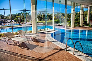 Sunbeds in the indoor swimming pool