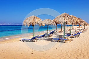 Sunbeds on Plaka beach, Naxos island photo