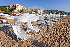 Sunbeds and sun umbrellas on the beach