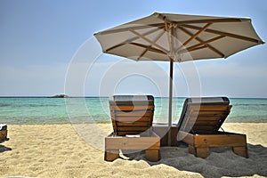 Sunbeds and umbrella on the beach