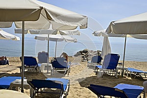 Sunbeds and umbrellas on beach