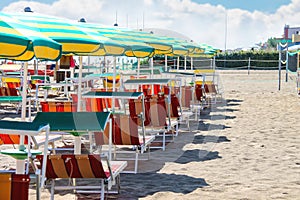 Sunbeds and umbrellas on the beach in Bellaria Igea Marina, Rimini, Italy