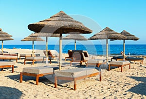 Sunbeds and umbrellas on a sandy beach