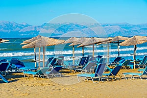 Sunbeds and umbrellas at Sidari beach at Corfu, Greece