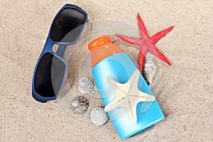 Sunblock, sunglasses, shells and starfish