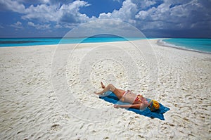 Sunburning on the sandy beach