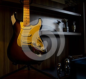 Sunburst Electric Guitar On Stand