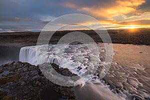 Sunburst over Dettifoss waterfall in Iceland