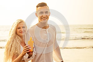 Suncare couple on a summer beach vacation have good skincare with high spf sunblock suncream. Handsome man sun tan