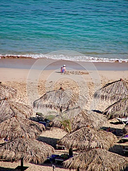 Sunchairs and umbrellas on the sea beach