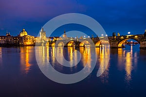 sundawn scene of Charles Bridge over Vltava river in Prague city, Czech Republic