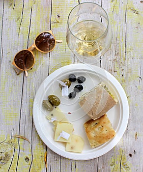 The sunday aperitive is ready with white wine and some snack photo