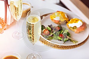 Sunday brunch with prosecco and eggs benedict