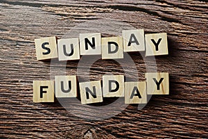 Sunday Funday alphabet letter on wooden background