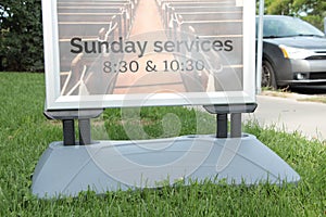 sunday services 830 and 1030 time sign information on grass lawn 52 p 17