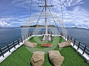 Sundeck of a wooden phinisi boat the best place to enjoy the sunset moment