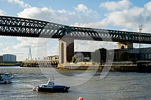 Sunderland UK: oct 2022: The Queen Alexandra Bridge at the River Wear in Sunderland on a sunny autumn day, with fishing boats