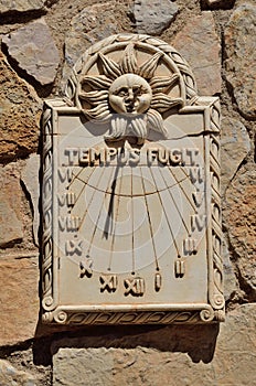 Sundial on the ancient wall in Siurana