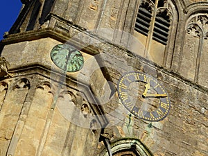 Sundial and clock on church tower