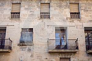 Sundial drawn on the facade of an old building in Spain