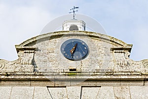 Sundial on an old building facade