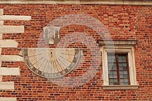A sundial placed on the wall. Sandomierz photo