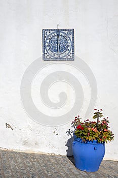 Sundial placed on a wall on a street in Vejer de la Frontera, Spain photo