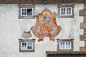 Sundial in secco painting from 1628 on ZeugwartstÃ¶ckl, historic building on Mozartplatz, Salzburg, Austria