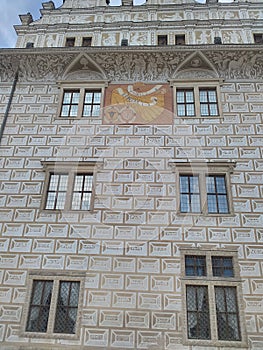 Sundial between windows