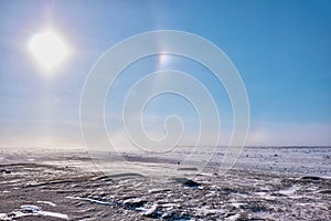 A sundog over the winter tundra in northern Canada.