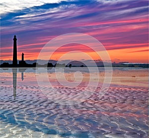 Sundown and lighthouse silhouettes