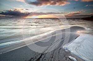 Sundown during low tide on Ijsselmeer lake