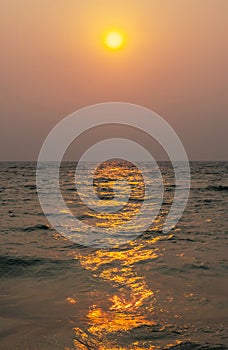 Sundown reflected on ocean surface. Inspiration summertime background