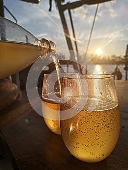 Sundowners enjoying drinkie on sail boat in Balambangan Island.