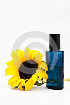 Sunflower and a bottle of perfume