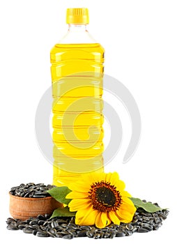 Sunflower oil in plastic bottle, seeds and flower isolated on white background