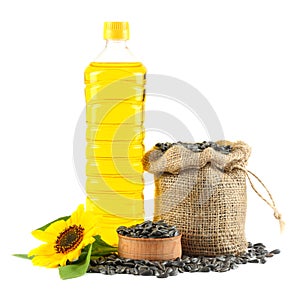 Sunflower oil in plastic bottle, seeds and flower isolated on white background
