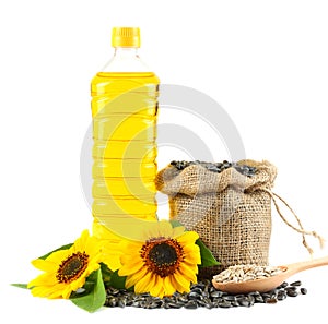 Sunflower oil in plastic bottle, seeds and flower isolated on white background