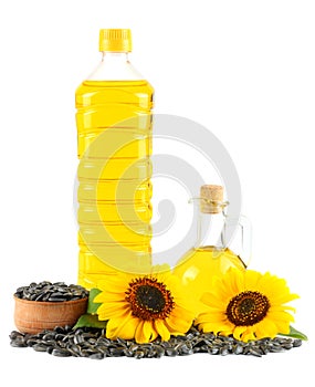 Sunflower oil in plastic bottle, seeds and flower isolated on white background