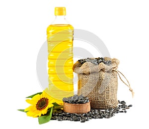 Sunflower oil in plastic bottle, seeds and flower isolated on white background