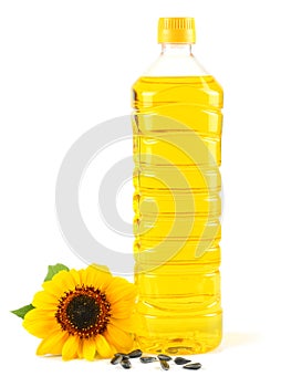 Sunflower oil in plastic bottle, seeds and flower isolated on white background