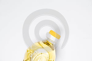 Sunflower oil in a plastic bottle on a white background close-up